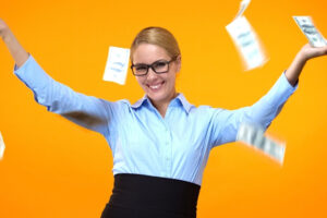 a person in glasses is throwing money in the air