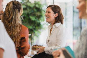 a person is talking to other people at an event