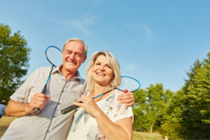 An old couple with rackets