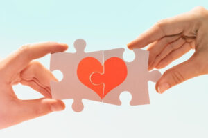 fitting puzzle making the image of a heart shape