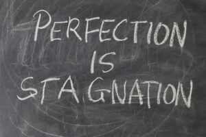 perfection is stagnation written on a blackboard