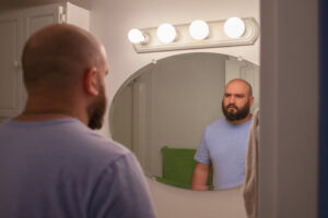 a person is looking at themselves in the mirror