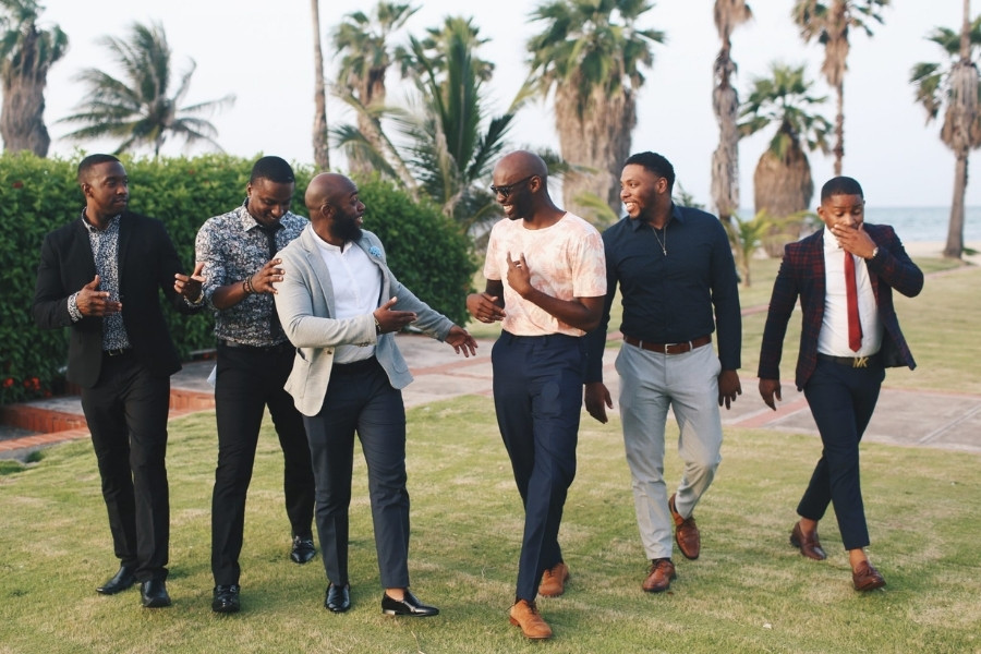 A group of men walking in the field