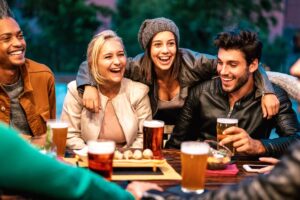 a group of friends having a beer at an outdoor bar