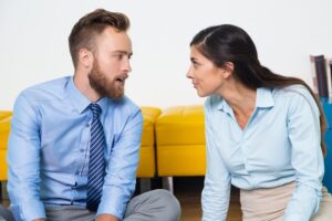 Two people are sitting next to each other