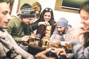 a group of people sitting around a table with drinks